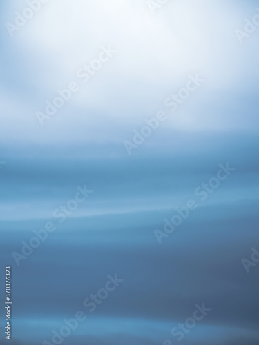 Abstract water wave with sky and light as background. © Kanokwan