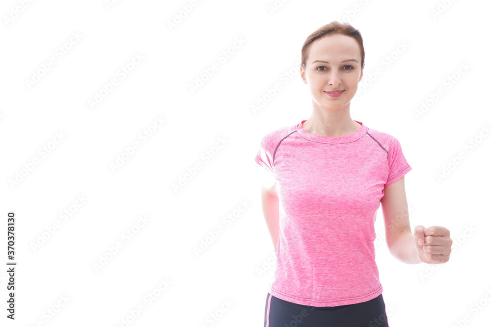 ランニングをする笑顔の若い女性 ランニングをする笑顔の若い女性