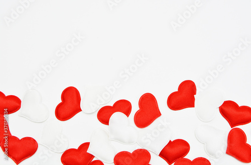 Red and white hearts on a white background