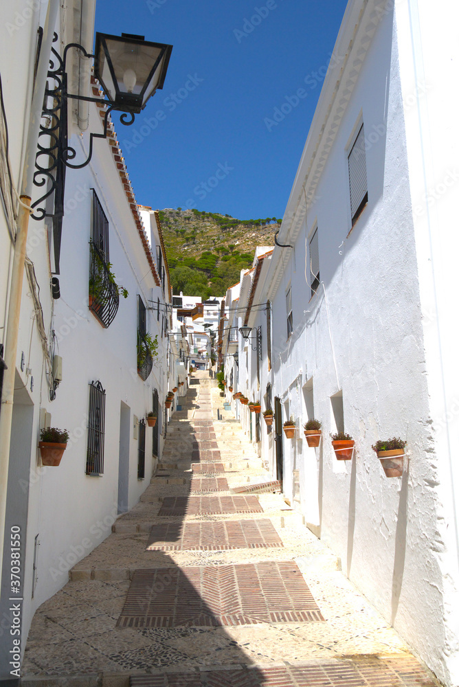 Townhouses facades along a typical street, in this white village, Medina Sidonia, Cadiz, Andalusia, Spain