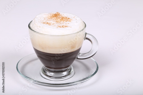 Fototapeta Naklejka Na Ścianę i Meble -  Delicious coffee  in a glass cup on a white background