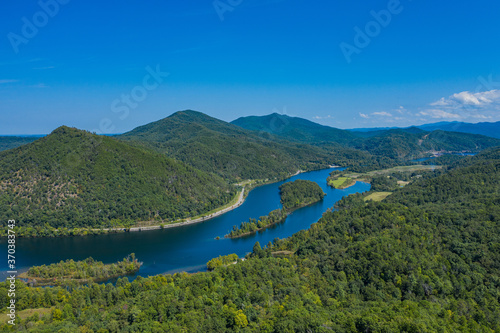 landscape with river  mountains  and blue sky