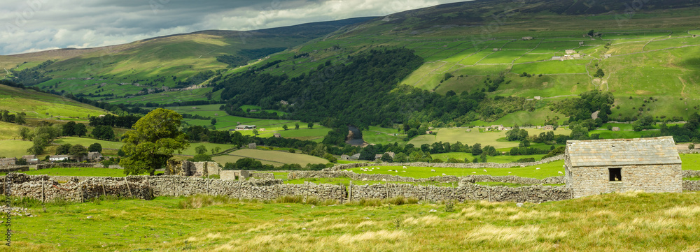 Panorama of Swaledale above the villages of Gunnerside and Muker in Summer.  Swaledale is a remote, scenic area in the Yorkshire Dales, UK. 