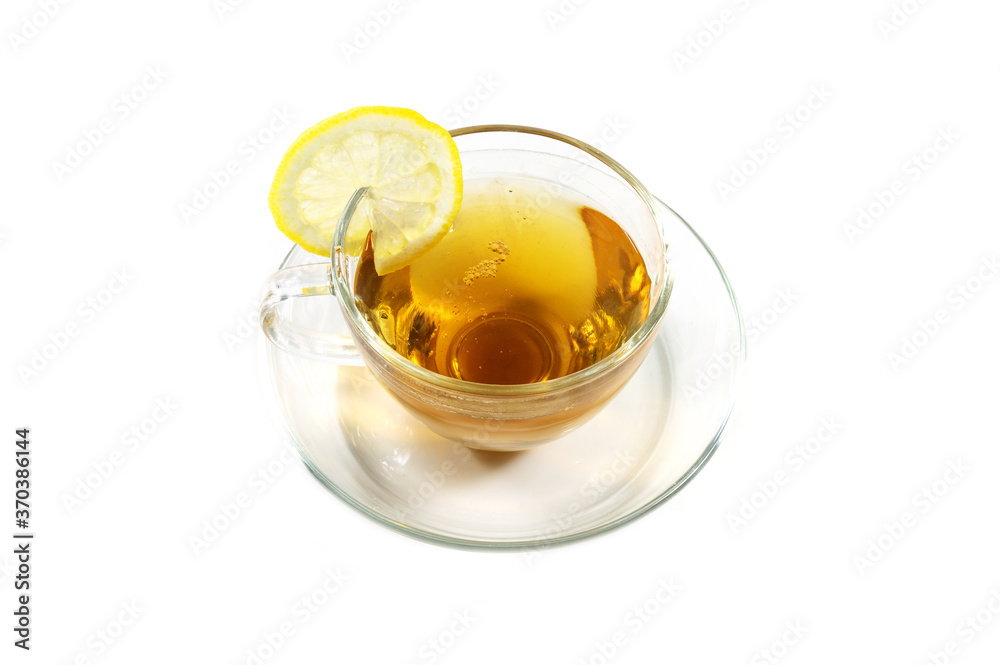 Black tea with a lemon slice in a glass cup, isolated on a white background, copy space