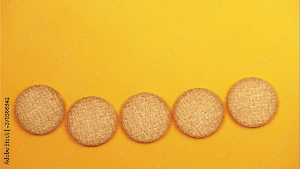 stop motion animation with five biscuit on orange background