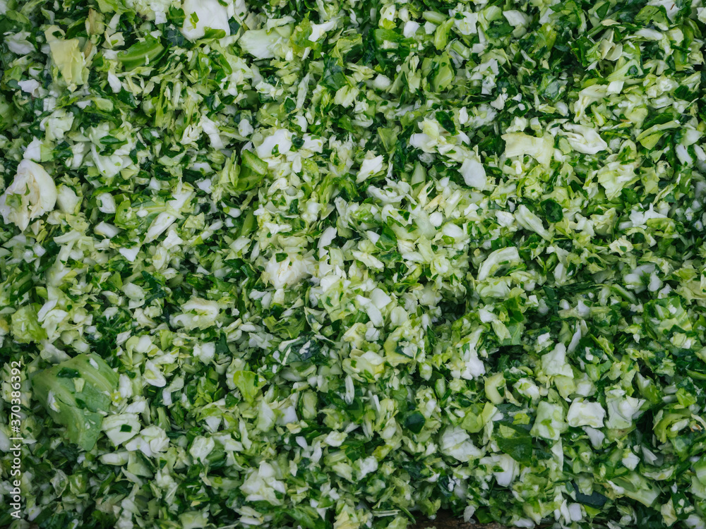 chopped fresh green cabbage for cooking traditional Russian cabbage soup close-up chopped fresh green cabbage for cooking traditional Russian cabbage soup close-up