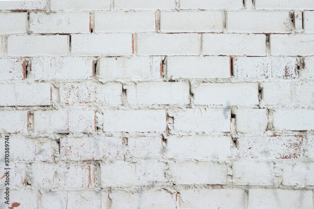 Whited painted shabby brick grunge wall texture for macro background Whited painted shabby brick grunge wall texture for macro background