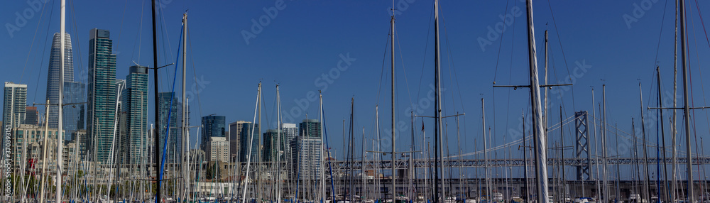 Boats and view of San Francisco skyline and Bay Bridge at South Beach Harbor Marina