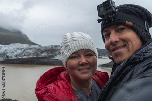 a couple takes a selfie at the Svinafellsjokull Glacier