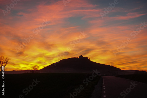Sunset over the Camino - The french Way of  Camino de Santiago  in Winter. Pilgrimages on their journey through Spain