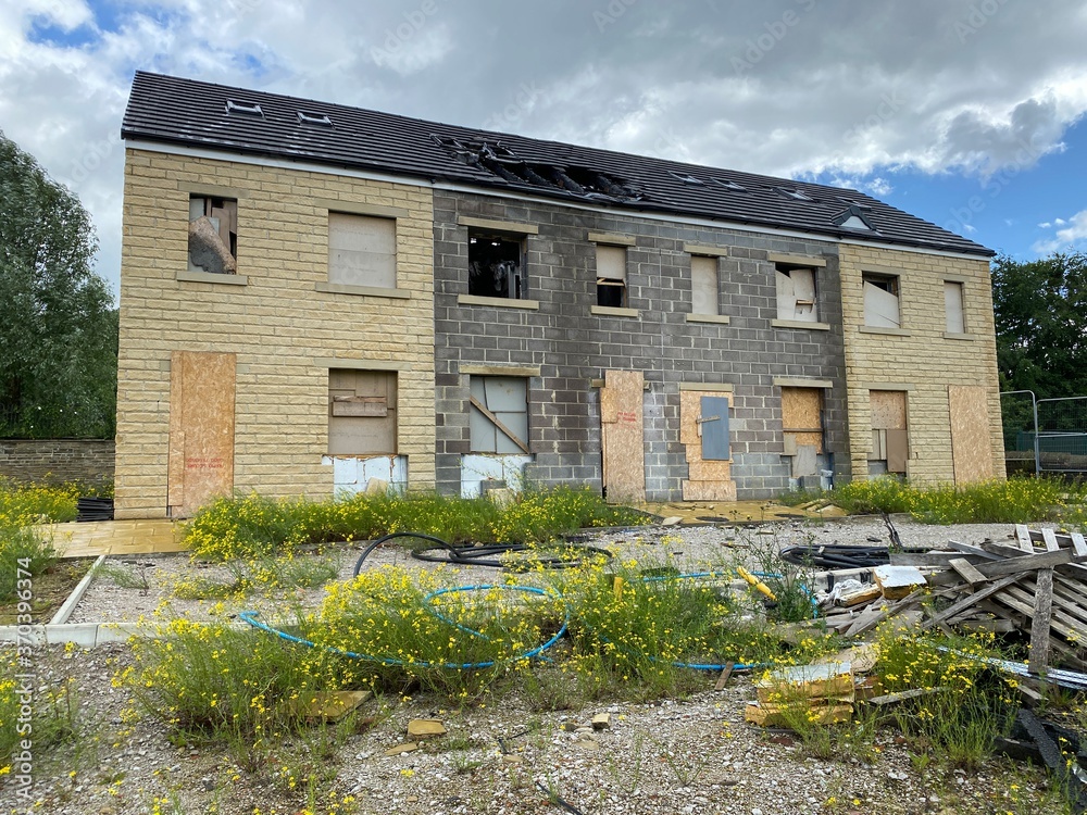 Derelict building, and rubble on a waste site in, Bradford, Yorkshire, UK