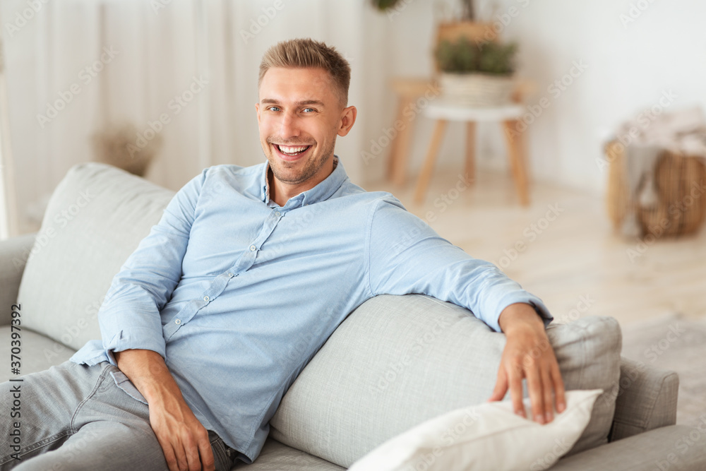 Guy having rest at home on his sofa Guy having rest at home on his sofa