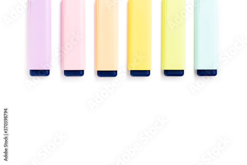Pastel highlighters on white background