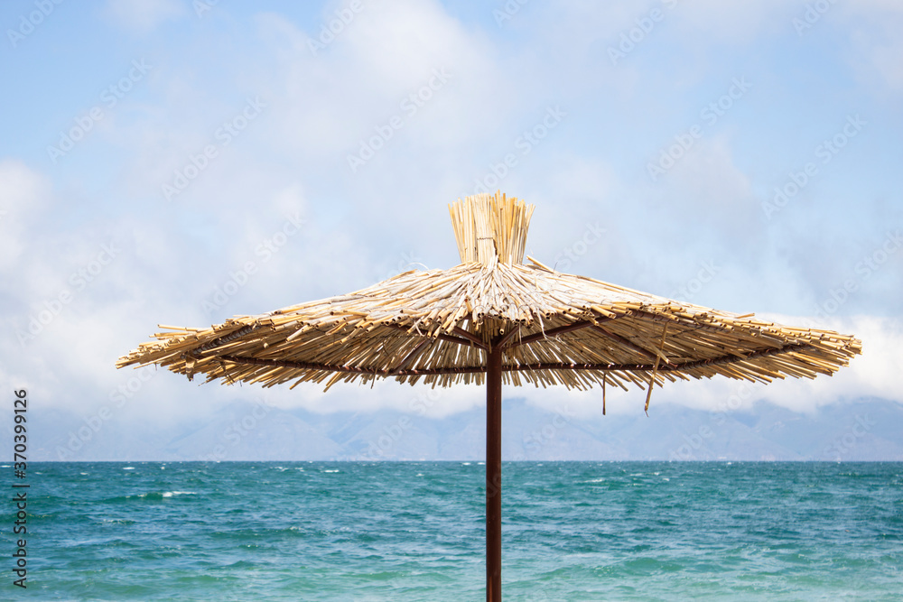 straw umbrella  on the beach