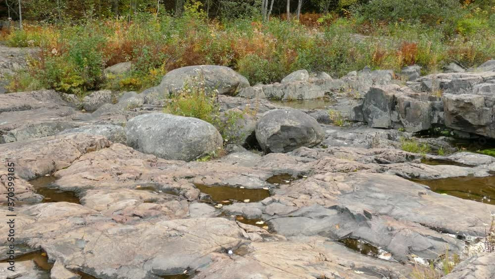 Small rain pools forming on rocky terrain in southeastern Canada Small rain pools forming on rocky terrain in southeastern Canada