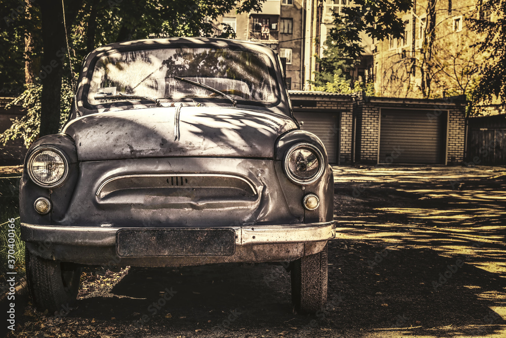 Old retro car weathered vintage auto.