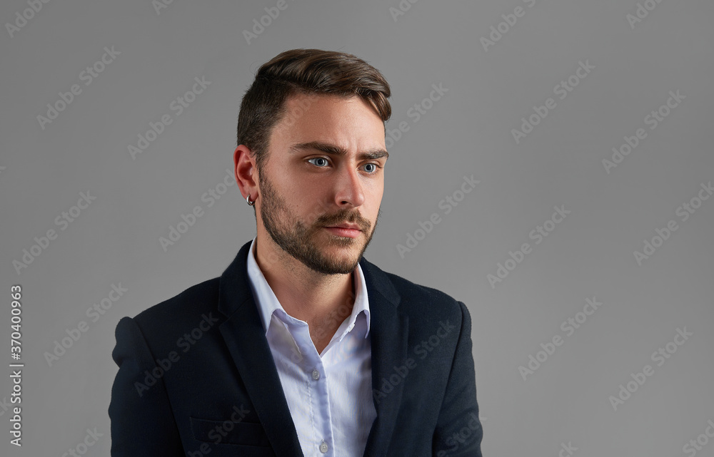 Close up portrait young man businessman. Caucasian guy business suit studio gray background. Close up portrait young man businessman. Caucasian guy business suit studio gray background.