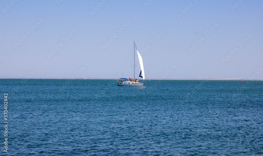 Sailing yacht in the sea on a clear Sunny day. The concept of travel and an active lifestyle