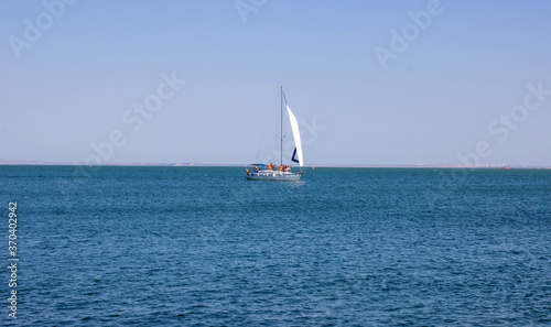 Sailing yacht in the sea on a clear Sunny day. The concept of travel and an active lifestyle