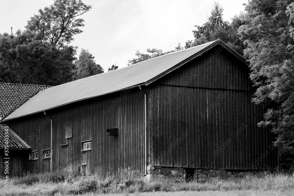 Monochrome photograph of a large barn in Sweden Monochrome photograph of a large barn in Sweden