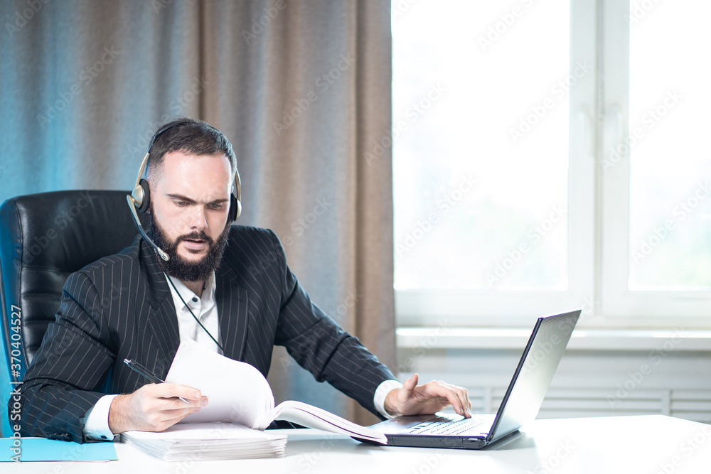 A man in a business suit and headphones with a microphone. A person works with documents. A man in the office. The lawyer is studying the agreement. A man next to a laptop. A man in a business suit and headphones with a microphone. A person works with documents. A man in the office. The lawyer is studying the agreement. A man next to a laptop.