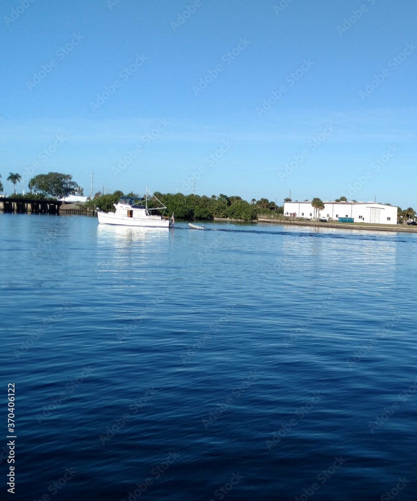 Boat on Harbor with Blue water and blue sky