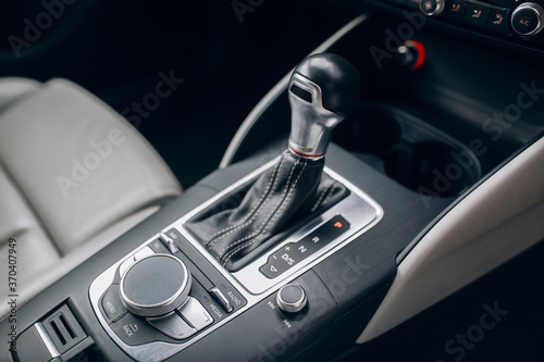 Modern and expensive car interior and gearbox shift handle  © Moose