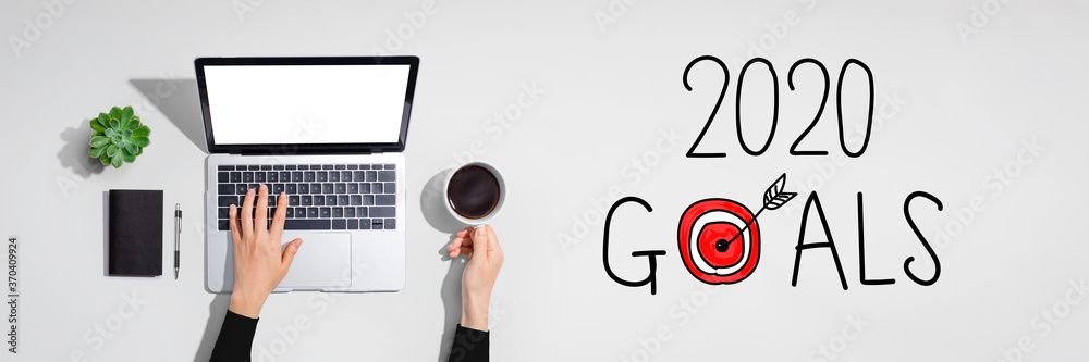 2020 goals concept with person using a laptop computer 2020 goals concept with person using a laptop computer