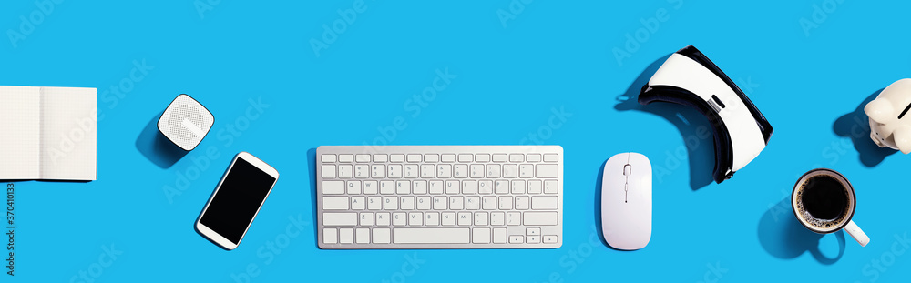 Computer keyboard with digital devices - flat lay Computer keyboard with digital devices - flat lay