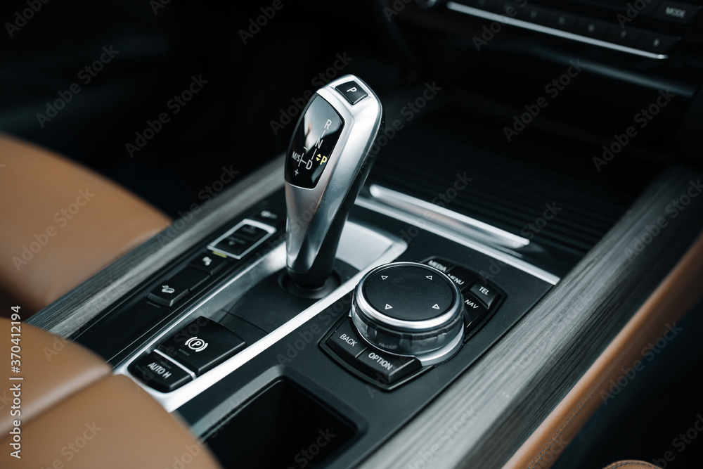 Fototapeta premium Modern and expensive car interior and gearbox shift handle 