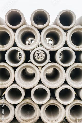 Group of concrete sewer pipes stacked at factory