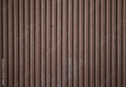 Metallic striped corrugated brown background. Texture.