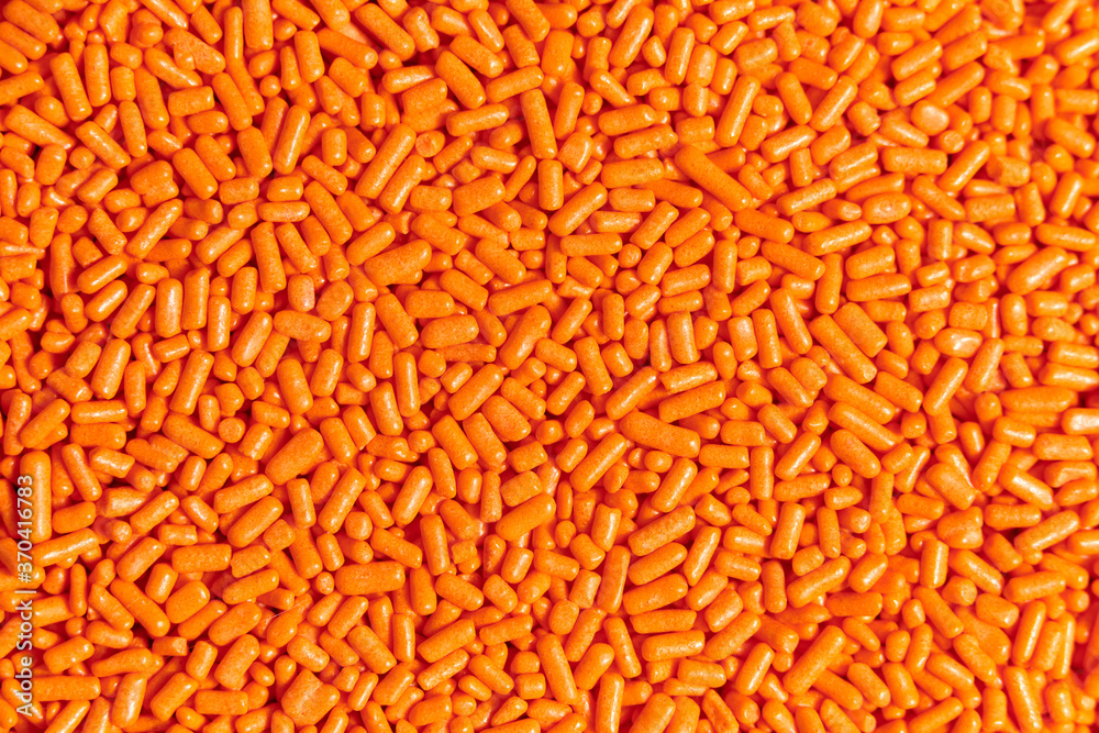 Orange sprinkles macro background, halloween theme Orange sprinkles macro background, halloween theme