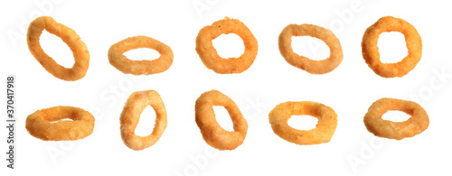 Fried onion rings falling on white background, banner design photo