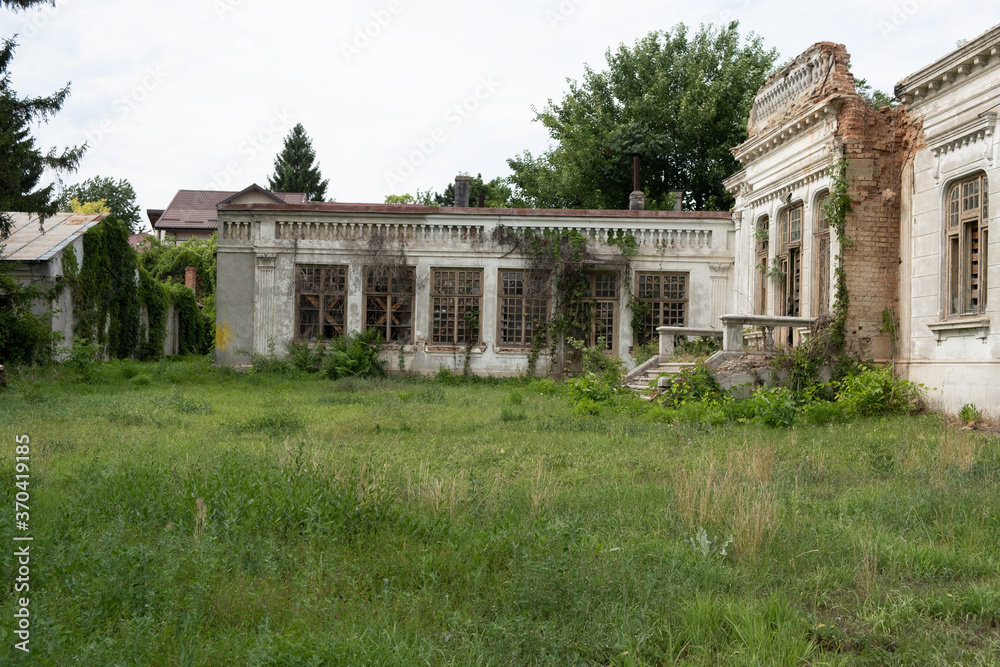 Old house with a unique design in baroque style in Romania abandoned and allowed to grow grass 
