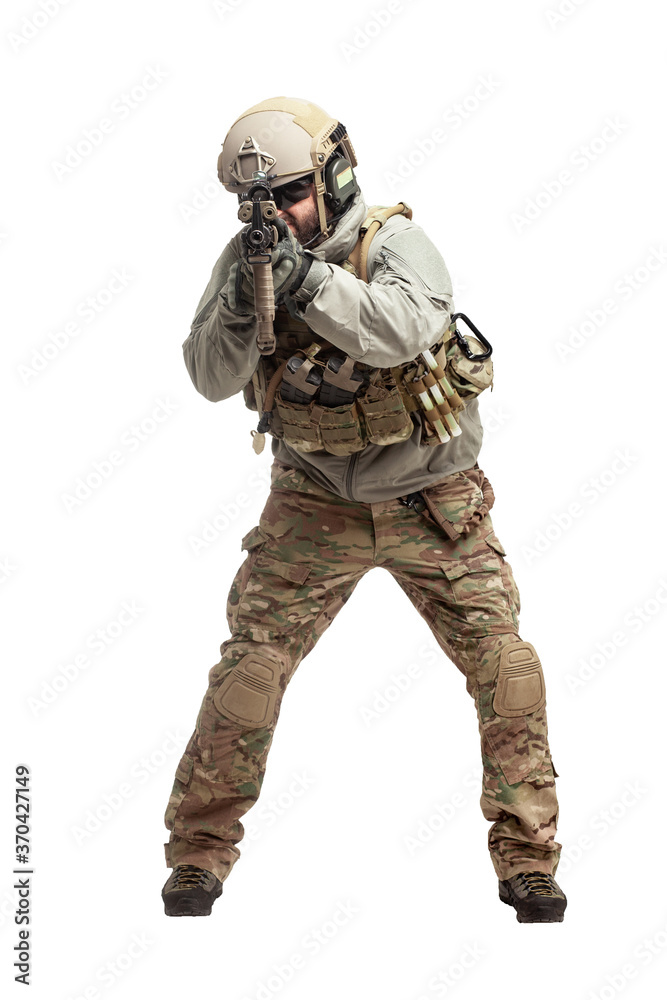 American soldier in military equipment with a rifle attacks on a white background, a commando with weapons in uniform, a ranger in action American soldier in military equipment with a rifle attacks on a white background, a commando with weapons in uniform, a ranger in action