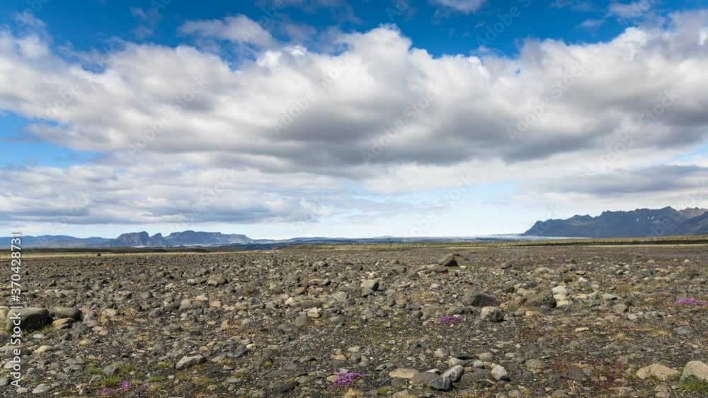 Moving clouds over a volcanic plain in Southern Iceland on a sunny summer day - Time lapse Moving clouds over a volcanic plain in Southern Iceland on a sunny summer day - Time lapse