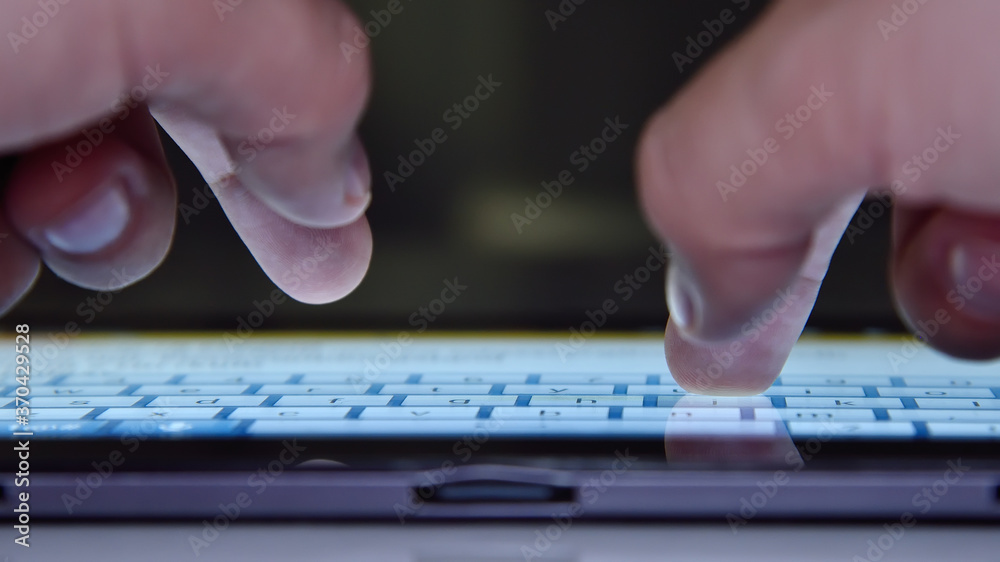 Hands typing on keyboard of tablet computer. Hands typing on keyboard of tablet computer.