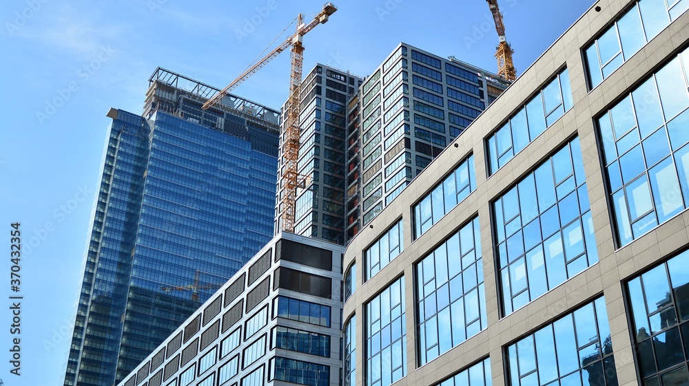 High-rise building under construction. Modern office building. High-rise building under construction. Modern office building.