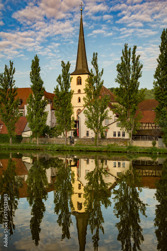 A church on the bank of the Main River with a perfect reflection, at Baden-Wurttemberg, Germany © Bob