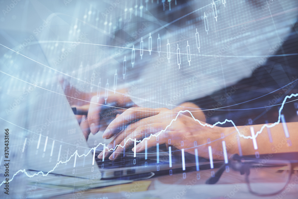 Multi exposure of woman hands typing on computer and financial graph hologram drawing. Stock market analysis concept. Multi exposure of woman hands typing on computer and financial graph hologram drawing. Stock market analysis concept.