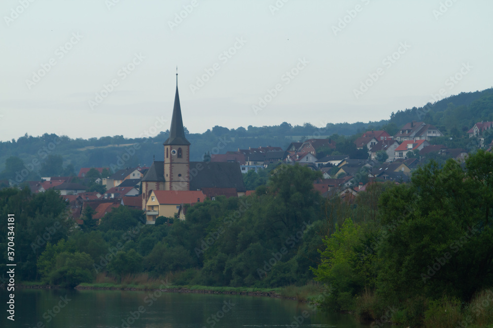 A church in a residential area on the bank of the Main River in Baden-Wurttemberg, Germany