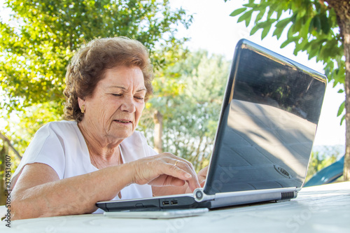 senior woman working with laptop