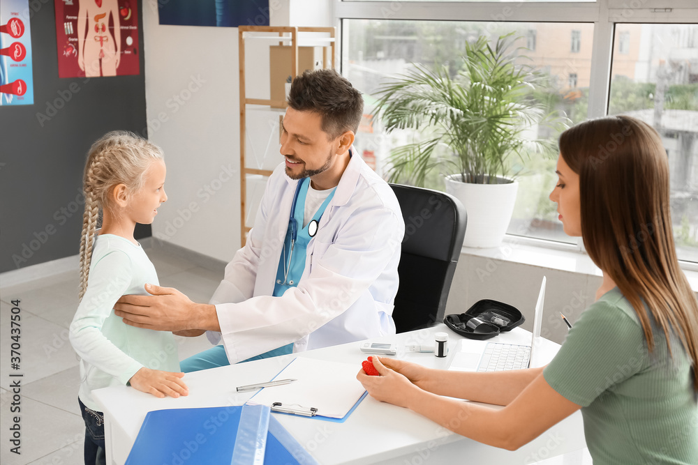 Fototapeta premium Mother with daughter visiting endocrinologist in clinic