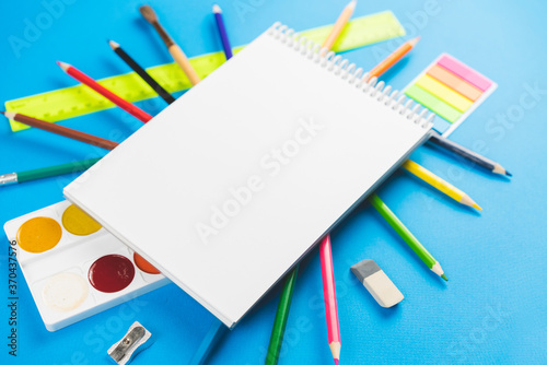 School supplies on a blue background.