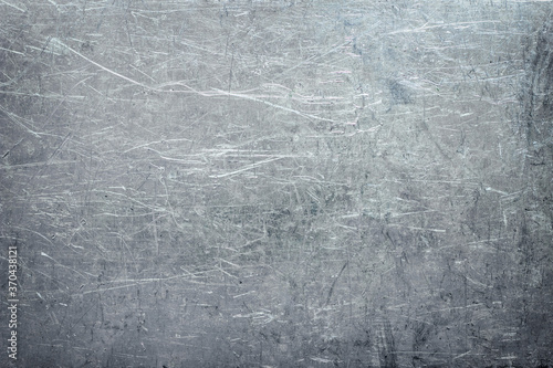 Crumpled metal texture with scratches and scuffs, stainless steel wallpaper