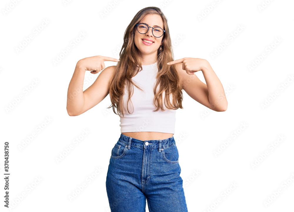 Beautiful caucasian young woman wearing casual clothes and glasses looking confident with smile on face, pointing oneself with fingers proud and happy. Beautiful caucasian young woman wearing casual clothes and glasses looking confident with smile on face, pointing oneself with fingers proud and happy.