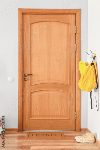 Interior of modern stylish hallway with door mat