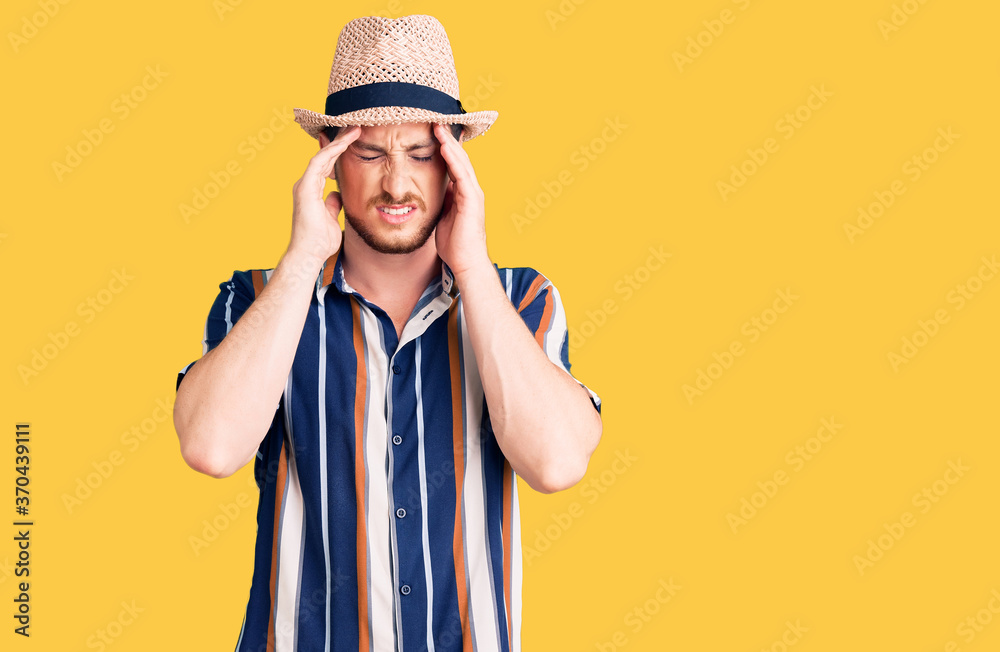 Young handsome caucasian man wearing summer hat with hand on head for pain in head because stress. suffering migraine. Young handsome caucasian man wearing summer hat with hand on head for pain in head because stress. suffering migraine.