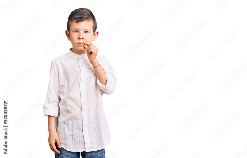 Cute blond kid wearing elegant shirt mouth and lips shut as zip with fingers. secret and silent, taboo talking Cute blond kid wearing elegant shirt mouth and lips shut as zip with fingers. secret and silent, taboo talking